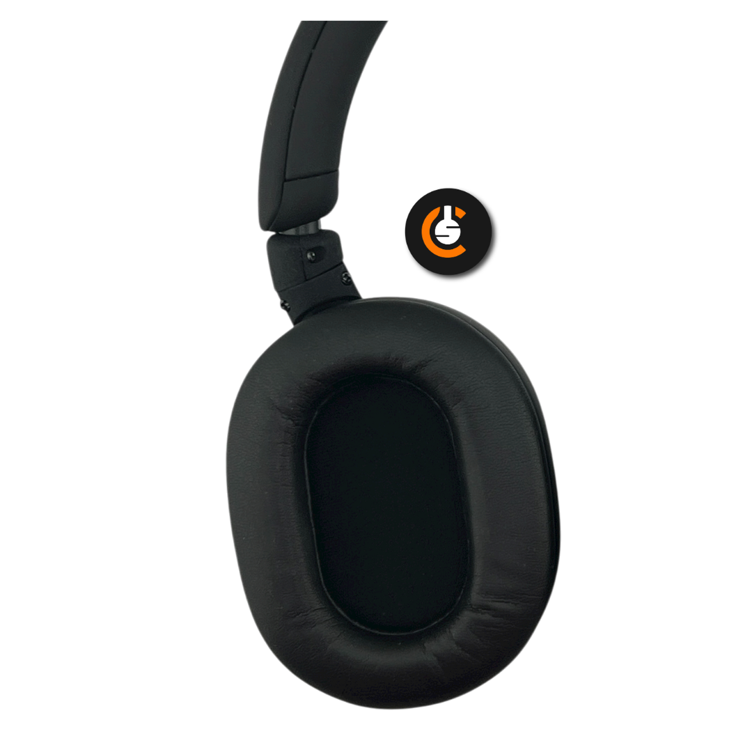 Black over-ear headphone with a cushioned ear pad and a circular logo in the corner.